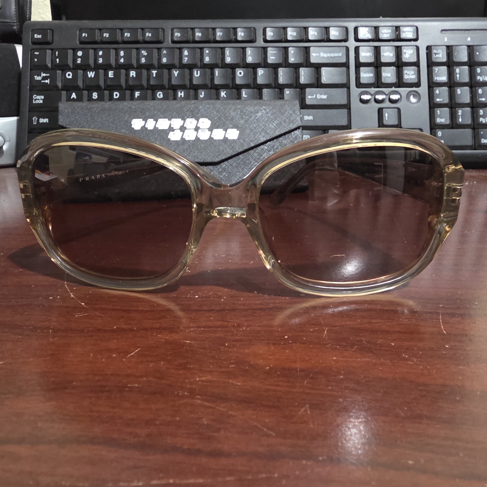 Prada sunglasses with a translucent speckled tan design